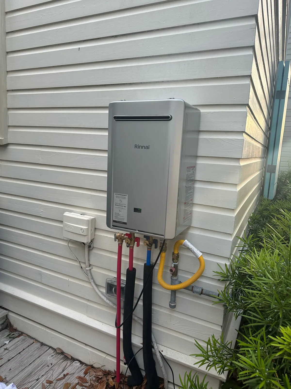 Rinnai tankless water heater installed on the exterior of a home
